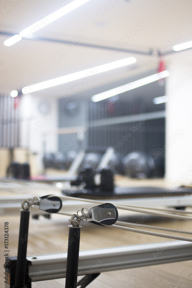Fototapeta premium Pilates machine in gym studio