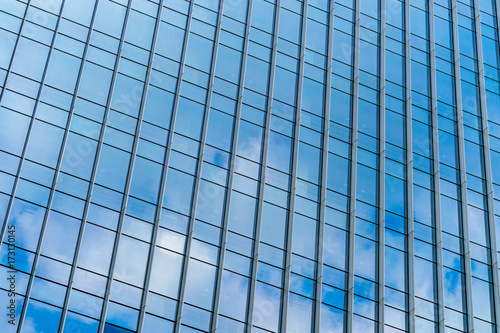 Clouds Reflected in Windows of Modern Office Building..