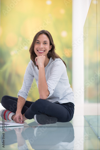Free Download young women using laptop computer on the floor - GFXLoad