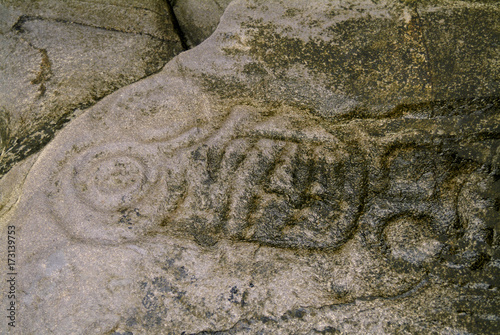 Ancient Alaskan Petroglyphs in Stone. Some of the best surviving examples of native artistic expression are petroglyphs found in southeast Alaska.  photo