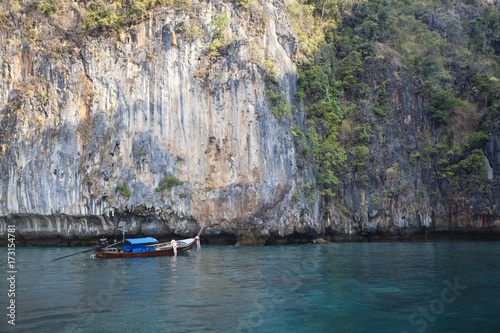 a long tail boat floating in phiphi island,Thailand  © jirasaki