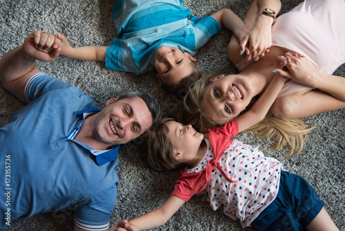happy family lying on the floor