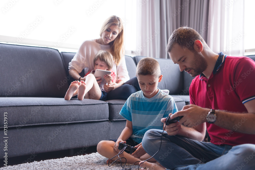 Happy family playing a video game Happy family playing a video game