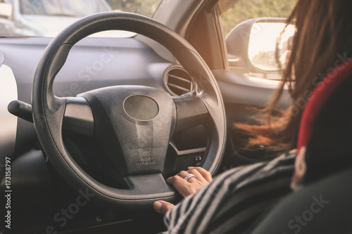 Close up of young attractive woman is driving a car. © Karlie Studio