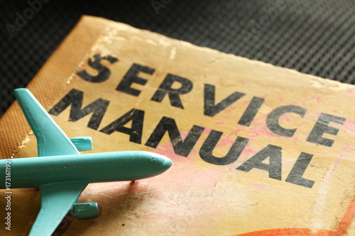 Model plane scene put on the old service manual book.