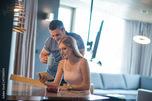 couple using tablet at home