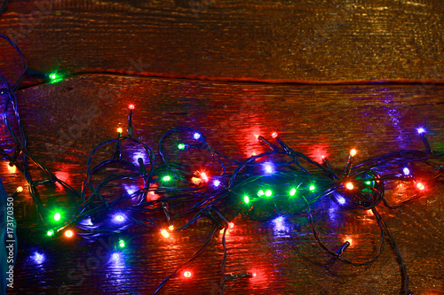 Christmas rustic background - vintage planked wood with lights and free text space