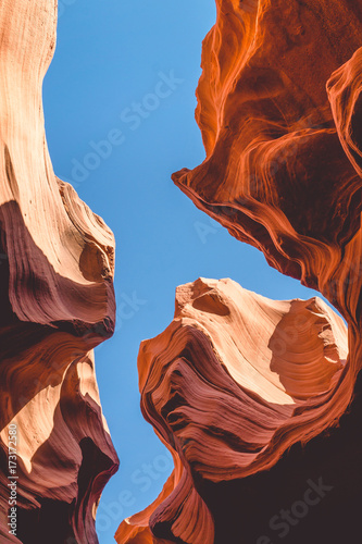 Sandstone rocks in the Antelope Canyon against the blue sky of Arizona
