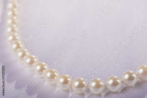 Pearls strand on white background