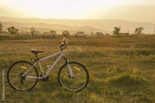 White Bicycle in the middle of a rural field