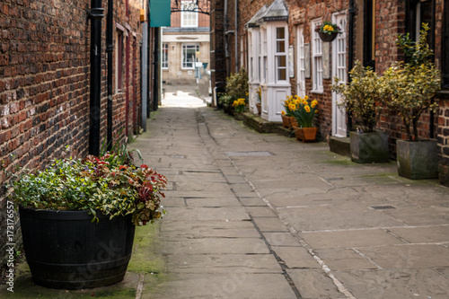 dark brick houses and cobblestones in the old city Thirsk, North Yorkshire, England, UK