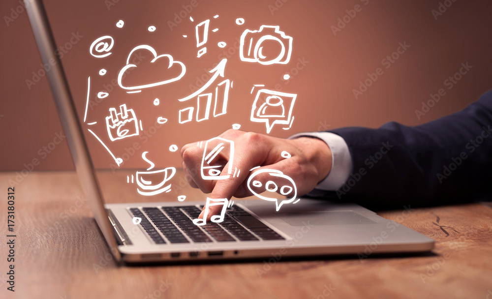 Office worker sitting in front of laptop Office worker sitting in front of laptop