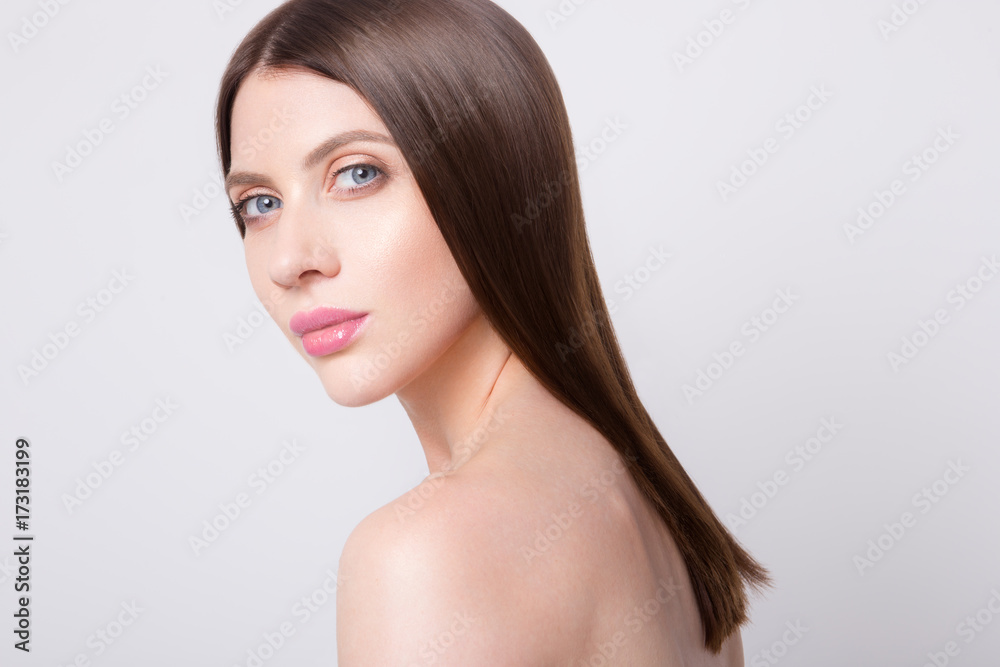 Beauty portrait of model with natural make-up. Fashion shiny highlighter on skin, sexy gloss lips make-up Beauty portrait of model with natural make-up. Fashion shiny highlighter on skin, sexy gloss lips make-up