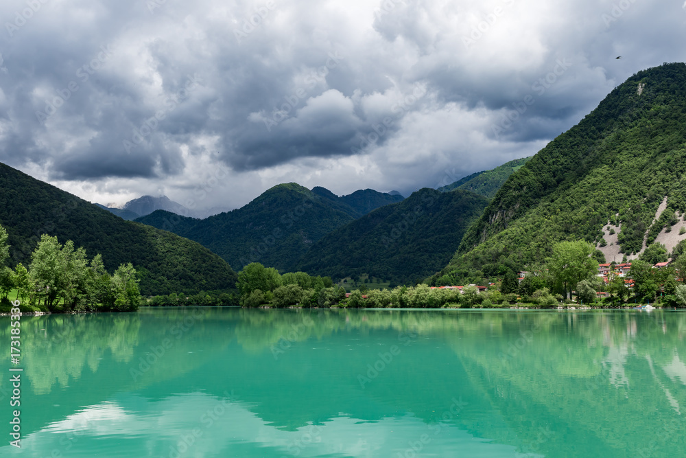 Large green lake under the mountains quiet water panoramic landscape nature of Europe Slovenia day time summer sunny  