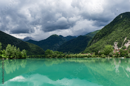 Large green lake under the mountains quiet water panoramic landscape nature of Europe Slovenia day time summer sunny 