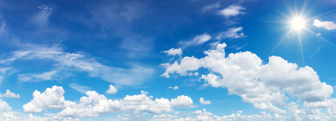 blue sky with clouds and sun reflection.The sun shines bright in the daytime in summer
