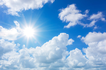 blue sky with clouds and sun reflection.The sun shines bright in the daytime in summer