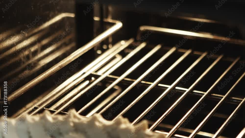 Close up, pie placed in oven Close up, pie placed in oven