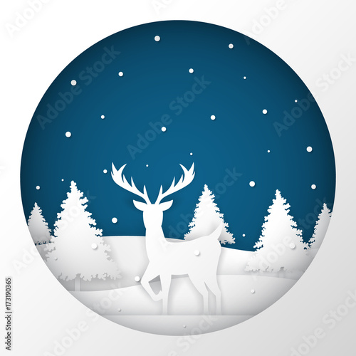 Deer standing in a snow field in Christmas night.