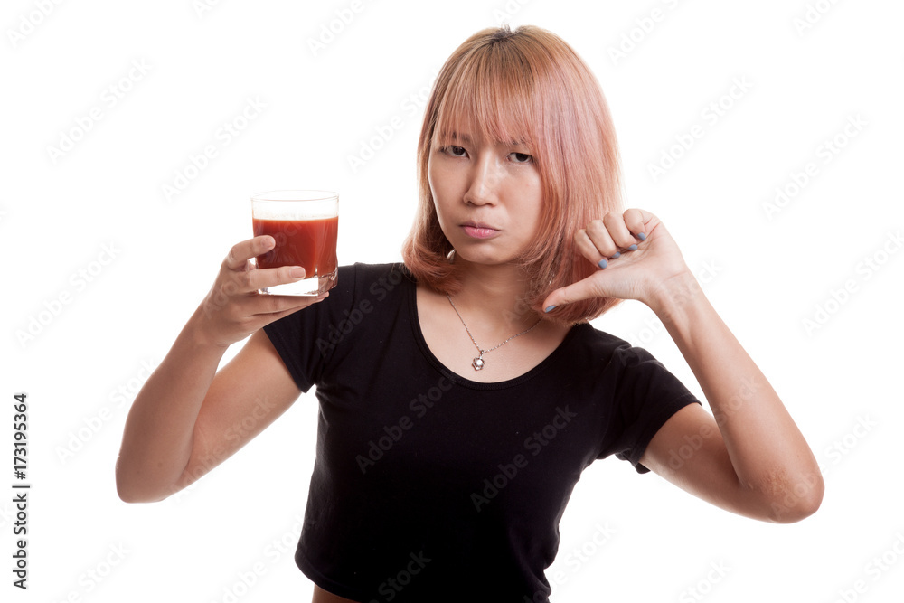 Asian woman thumbs down hate tomato juice. Asian woman thumbs down hate tomato juice.