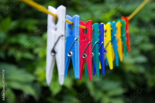 Colorful clothespins hanging on a clothesline (4)