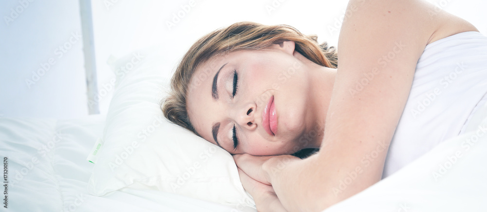 Beautiful young women lying on bed at home Beautiful young women lying on bed at home