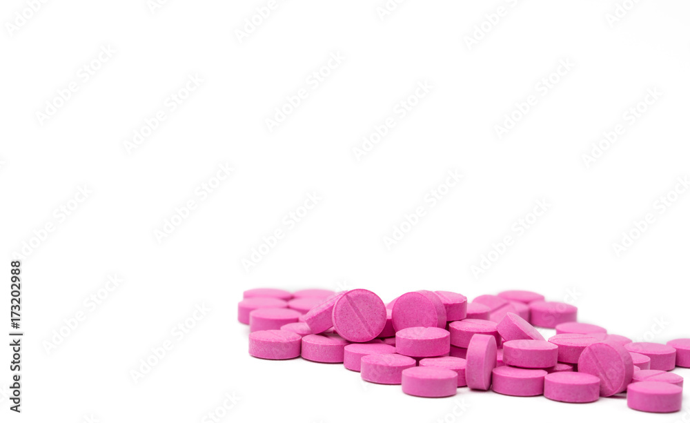 Pile of pink tablets pills isolated on white background with clipping path. Copy space Pile of pink tablets pills isolated on white background with clipping path. Copy space