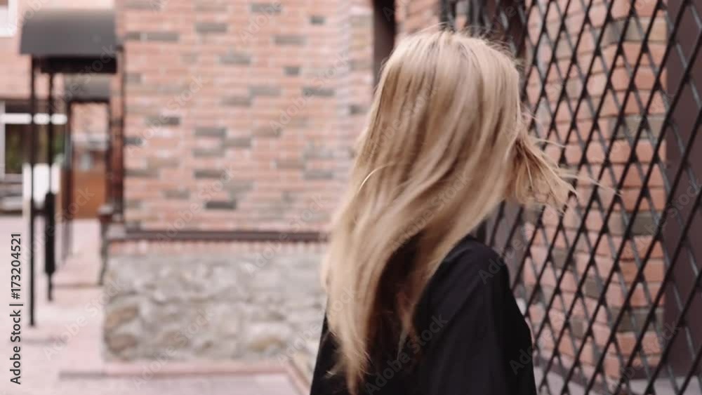 Beautiful girl walking in the old town Beautiful girl walking in the old town