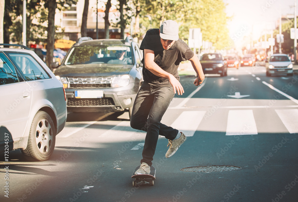 Pro skateboarder ride skateboard on capital road street through traffic