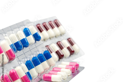 Colorful of antibiotic capsules pills in blister pack isolated on white background with clipping path. Drug resistance  antibiotic drug use with reasonable  health policy and health insurance concept.