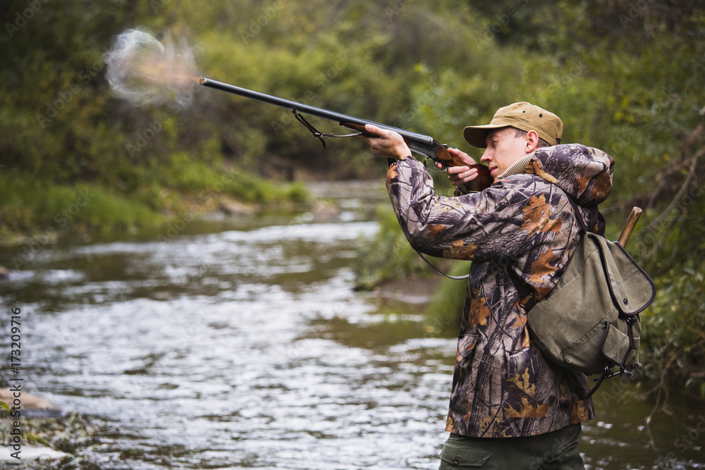The hunter shoots from the hunting rifle. The hunter shoots from the hunting rifle.