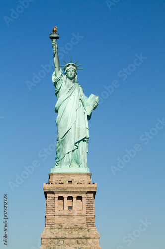 The Statue of Liberty in New York City at Liberty Island in a sunny day