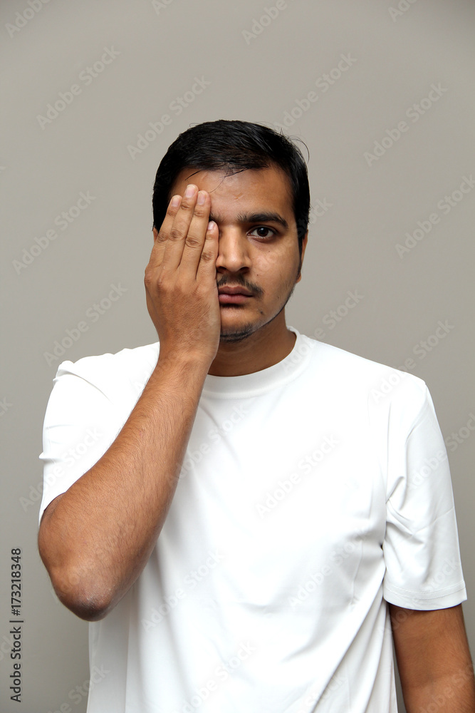 expressions of young amazed man isolated on gray background expressions of young amazed man isolated on gray background