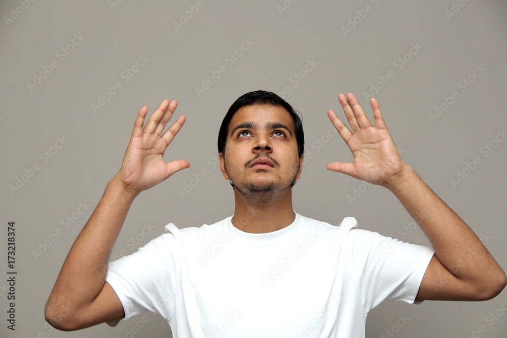 expressions of young amazed man isolated on gray background expressions of young amazed man isolated on gray background