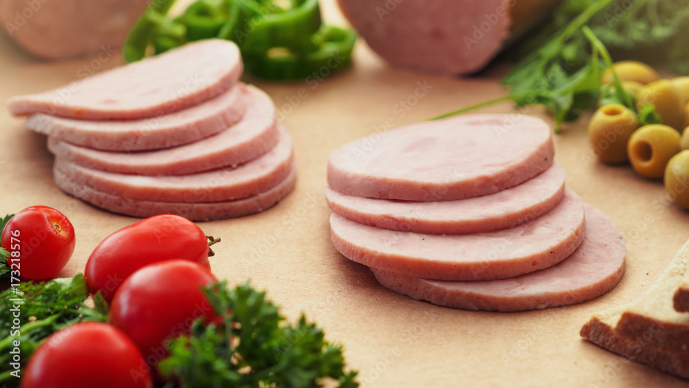 Cutted Ham Sausage on kraft paper background Cutted Ham Sausage on kraft paper background