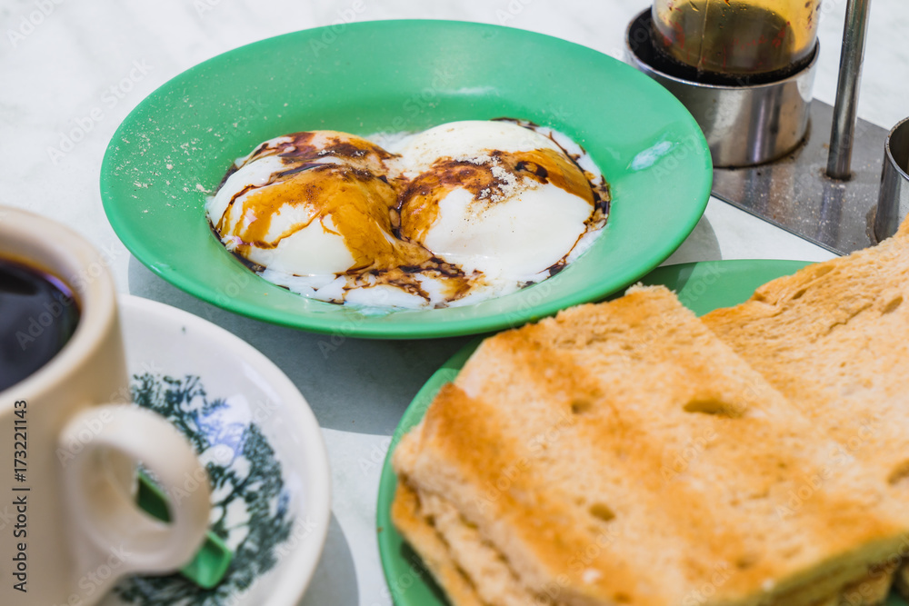 Singapore Breakfast Kaya Toast, Coffee bread and Half-boiled eggs Singapore Breakfast Kaya Toast, Coffee bread and Half-boiled eggs