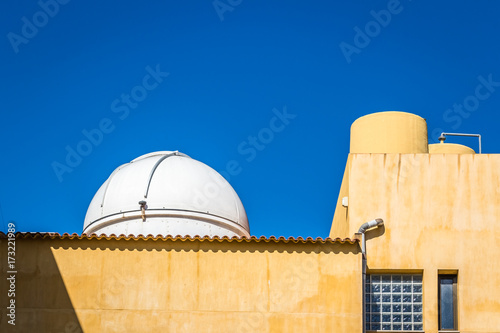 A small telescope dome on a rooftop in spain