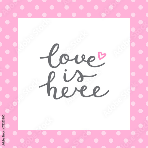 love is here lettering, vector handwritten text on polka dot pattern