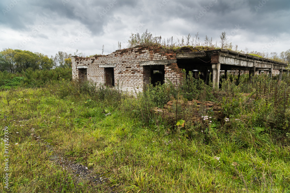 Dilapidated cowshed in an abandoned farm Dilapidated cowshed in an abandoned farm