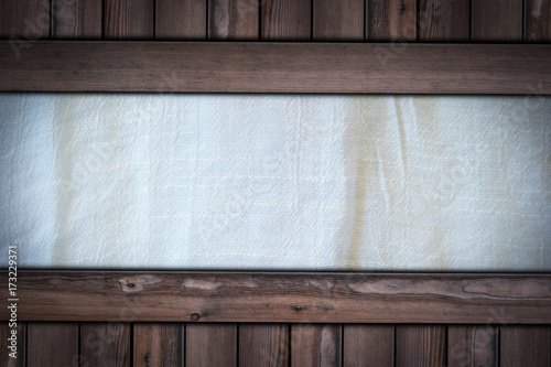 white fabric cloth texture on wooden background