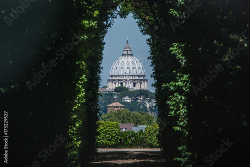 The dome of Saint Peters Basilica seen through the famous keyhole at the the gate of the Priory of the Knights of Malta on Aventino Hill. Rome, Italy, Southern Europe