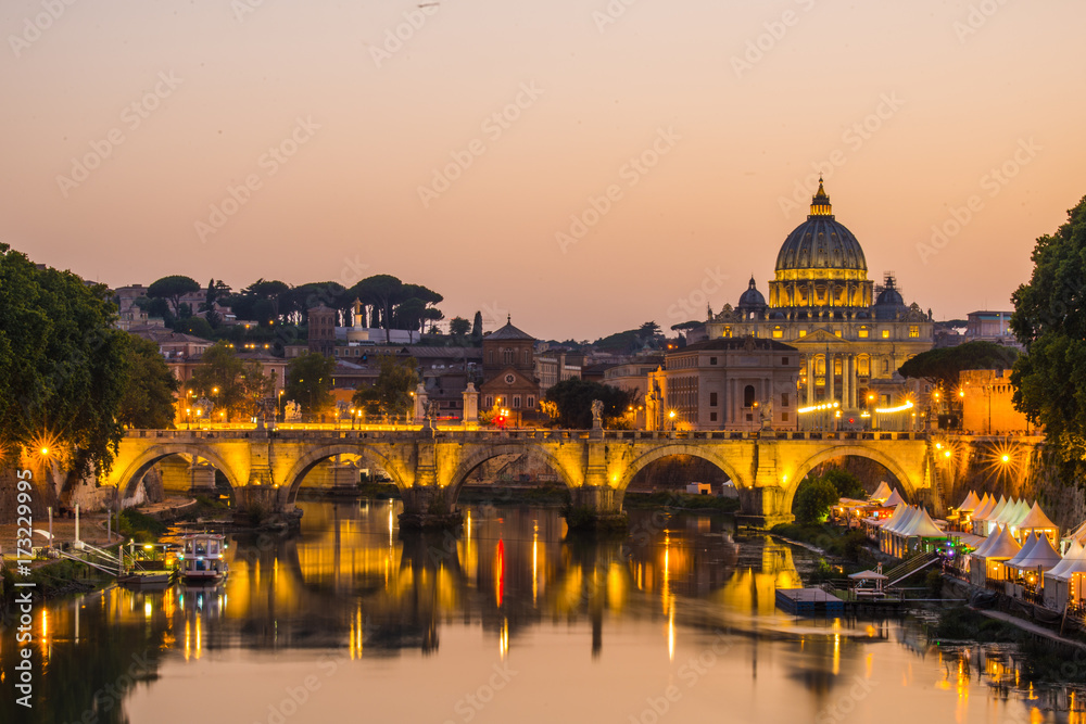 image of River Tiber, including: Ponte Sant Angelo and St. Peter's Basilica in the background. Rome - Italy.
