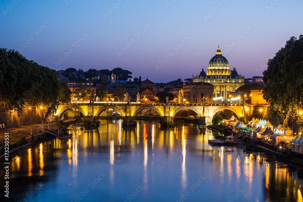 image of River Tiber, including: Ponte Sant Angelo and St. Peter's Basilica in the background. Rome - Italy.