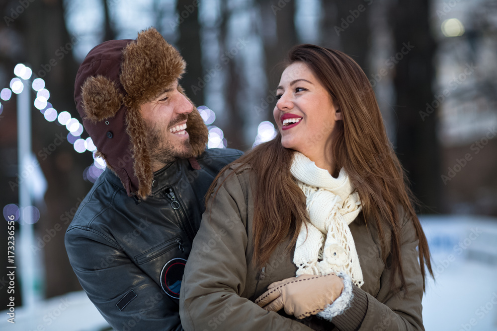 Fototapeta premium Young couple smiling and enjoy at wintertime moments