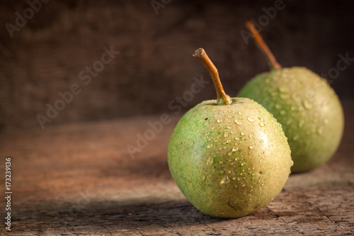 Bild auf Leinwand Two green pears in evening light