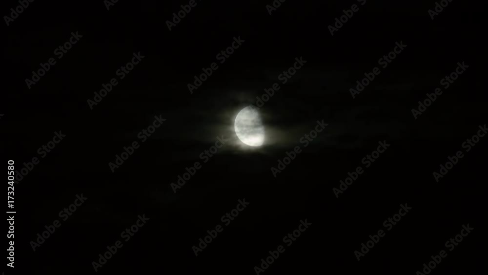 New moon and clouds in the pitchblack sky. Long shot New moon and clouds in the pitchblack sky. Long shot