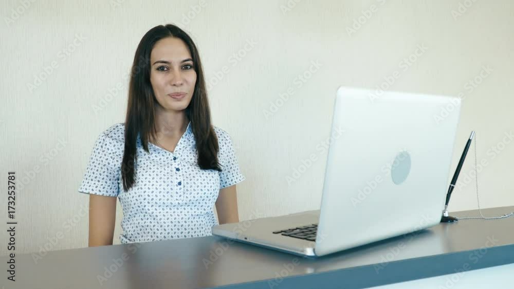 Portrait of a attractive smiling woman at the reception or the hotel company. People stock footage slider shot. Portrait of a attractive smiling woman at the reception or the hotel company. People stock footage slider shot.