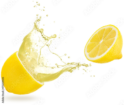 juice spilling out of a lemon isolated on white