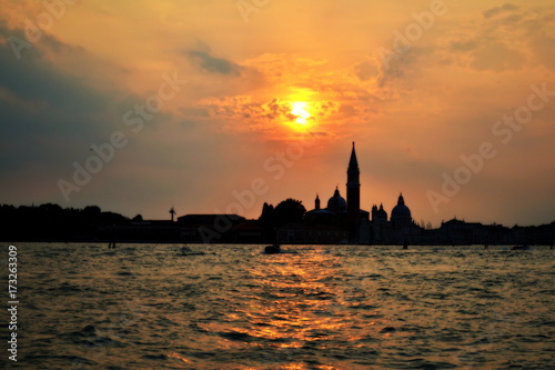 sunset on the sea against the backdrop of buildings in Venice © Alisa
