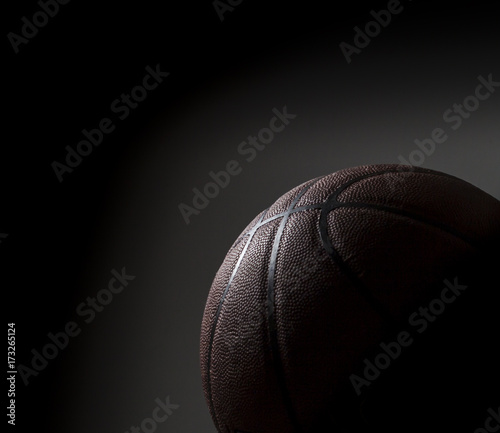 Basketball on black background © erik
